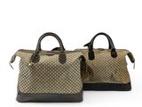 a pair of brown and black handbags sitting on top of each other