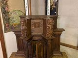 a small wooden table with a mirror on top of it