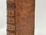 a brown leather book with gold trimmings on it