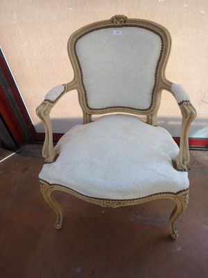 an image of a chair with a white upholstered seat
