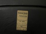 a close up of a black suitcase with a sticker on it