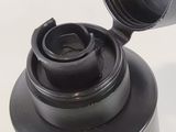 a close up of a bottle of water with a lid