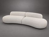 an image of a white couch sitting on top of a gray floor