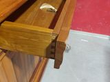 a drawer with a ring in it in a room