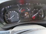 a close up of a car dashboard with a speedometer and gauges