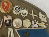 a close up of a hat with a lot of badges on it