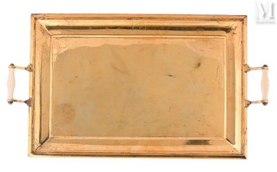 a gold tray with a handle and handles on it