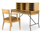 a desk with a chair next to it and a bookcase