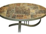 an image of a round table with a tile top and metal legs