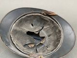 a hat with a bird on it sitting on a plate