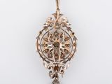 an image of a gold and diamond broochle on a white background