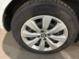 the tire of a white car with a black rim is shown