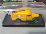 two toy cars in a display case on a table