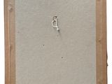 an old picture of a piece of paper with a metal ring on it