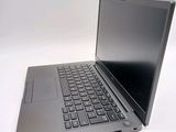 a laptop that is sitting on a white surface