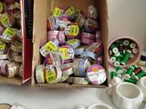 a box of candy and a cup of coffee on a table