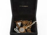 an image of a box with a bunch of gold and silver items in it