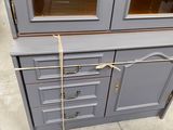 grey china cabinet with glass doors and drawers