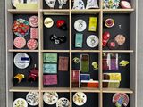 a display case with a variety of decorative items in it