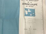 a map on the table with a piece of paper next to it