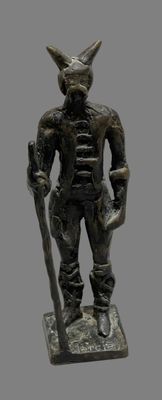 statue of a man with a horned head holding a baseball bat