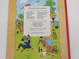 an old children ' s book with a picture of a man and a woman sitting on a bench