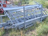 a pile of metal pipes in the middle of a field