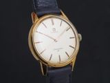 an image of a gold plated wrist watch with a black leather strap