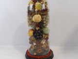 a glass jar filled with assorted fruits and nuts