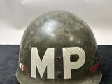 an army helmet with the word mp painted on it
