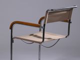 an image of a chair with a wooden seat and metal frame