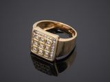 an 18k yellow gold ring set with diamonds