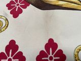 a close up of a fabric with a bird on it