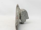 two pieces of stone sitting on top of each other