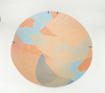 a plate with a design on it sitting on a table