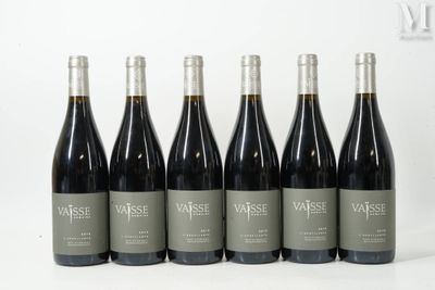 six bottles of wine are lined up in a row