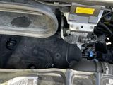 the engine compartment of a car with the hood open