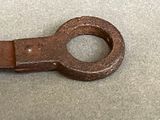 an old rusty key that is on a table