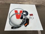 a sign that has a cable and a remote on it