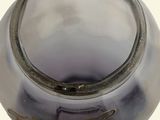 a close up of a glass vase with a bird on it