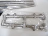 a bunch of metal pipes that are on a table