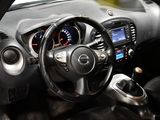 a steering wheel and dashboard of a car in a car showroom