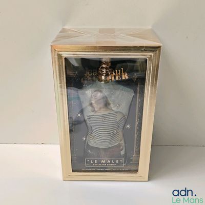the doll is in the box on the white surface