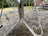 a table and chairs that are outside in the dirt