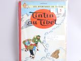 un vieux livre pour enfants avec l'illustration d'un homme qui skie en montagne