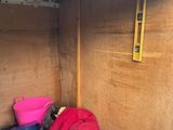 a small storage area in the back of a truck