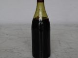 a bottle of wine that is sitting on a table