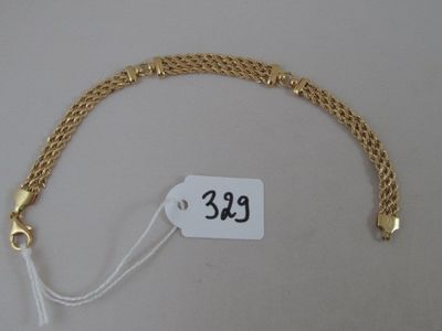 an image of a gold bracelet with a price tag attached to it