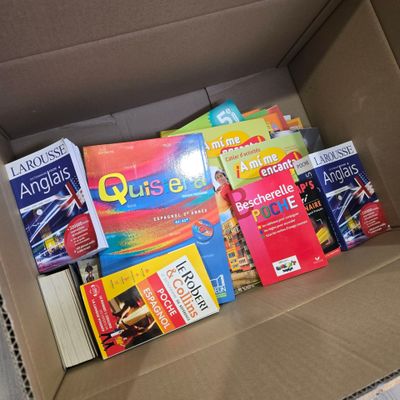 a box full of books that are sitting on the floor