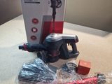 a box with a vacuum and some other items on the table